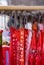 Close up of red ribbons with the copy `Gauchito Gil` in a souvenirs shop from the shrine to Gauchito Gil