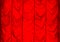 Close up of red silk pleated curtain