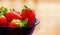 Close up red Strawberry isolated on blue bowl