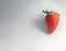 Close up red Strawberry isolated on white plate