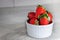 Close up red Strawberry isolated on white plate