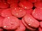 Close up of red velvet cookies with almonds arranged randomly