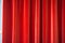 a close-up of red velvet stage curtains