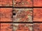 Close up of red weathered color on a wooden plank