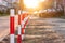 Close-up of red and white road bumpers on the background of sunset,road safety