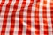 Close up of red and white wrinkly vichy fabric