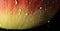 A close up of a red and yellow apple with water droplets, AI