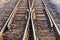 Close up of redirection old train or railroad tracks with wooden backing In the countryside