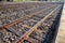 Close up of redirection old train or railroad tracks with wooden backing In the countryside