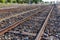 Close up of redirection old train or railroad tracks with wooden backing In the countryside