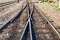 Close up of redirection old train or railroad tracks with wooden backing In the countryside