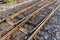 Close up of redirection old train or railroad tracks with wooden backing In the countryside