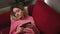 Close up relaxed woman hold use smartphone watching social media on the couch sofa at home. Attractive young woman uses