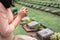 Close-Up of Religious Christian Woman Hands Clasped While Honoring and Praying to Military in War Cemetery. Teenager Woman in