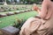 Close-Up of Religious Christian Woman Hands Clasped While Honoring and Praying to Military in War Cemetery. Teenager Woman in