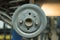 Close-up repair drum brake of car wheel in garage.