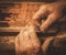 Close-up of restorer hands working with antique decor element in his workshop