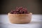 Close-up. Riceberry rice in a wooden bowl