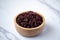 Close-up. Riceberry rice in a wooden bowl