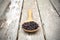 Close up of riceberry in spoon on old wooden