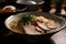 close-up of rich and creamy ramen broth, with floating slices of roast pork