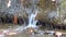 Close up of ridges of hard rock, oak leaves & clear creek water below Mash Fork Waterfalls on Camp Creek.