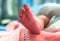 Close up Right foot of newborn baby in postpartum care unit in Phichai Hospital,Uttaradit province.