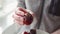 Close-up of a ripe black tomatoes on a plate. Woman shows a juicy tomato.