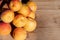 Close up of ripe Blenheim apricots freshly picked, on a wooden table, California