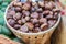 Close up of ripe chestnuts in a basket at the farmer`s market