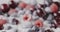 Close-up of a ripe juicy cherries, raspberries, blueberries with milk yogurt. Changing focus of berries background. Slow