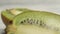 Close-up of ripe kiwi on a wooden background. Macro shot.