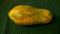 Close up of ripe papaya fruit on a banana leaf