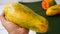 Close up of ripe papaya fruit on a banana leaf