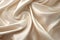 Close-up of rippled beige silk fabric as background