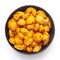 Close-up of Roasted Crunchy Peanuts in a ceramic black bowl, made with peanuts. Pile of Indian spicy snacks Namkeen,
