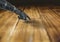 Close-up of robot hand touching wooden desk