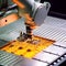 Close-up of a robotic arm in the factory delicately placing silicon wafers onto a production line. high-tech nature of solar cell