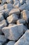 Close up. rock stone breakwater at the pier on the beach