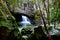 Close up of rocks and a waterfall in the cave