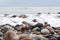 Close - up of rocky beach in the evening. Long exposure