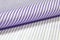 Close up roll light purple and white fabric of shirt