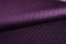 Close up roll purple fabric of shirt