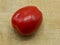 Close-up of A Roma Tomato Also Called Italian Tomato On A Cutting Board