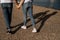 Close up of romantic couple hold hands and walk along the shore