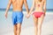 Close Up Of Romantic Couple Walking On Tropical Beach