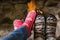 Close up of romantic legs in socks in front of fireplace