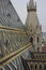 Close up of the roof and Steeple of Stephansdom cathedral from its top in Vienna