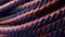 a close up of a rope with orange and blue stripes