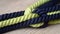 a close up of a rope on a wooden surface with a knot on it\\\'s end and a knot on the end of the rope